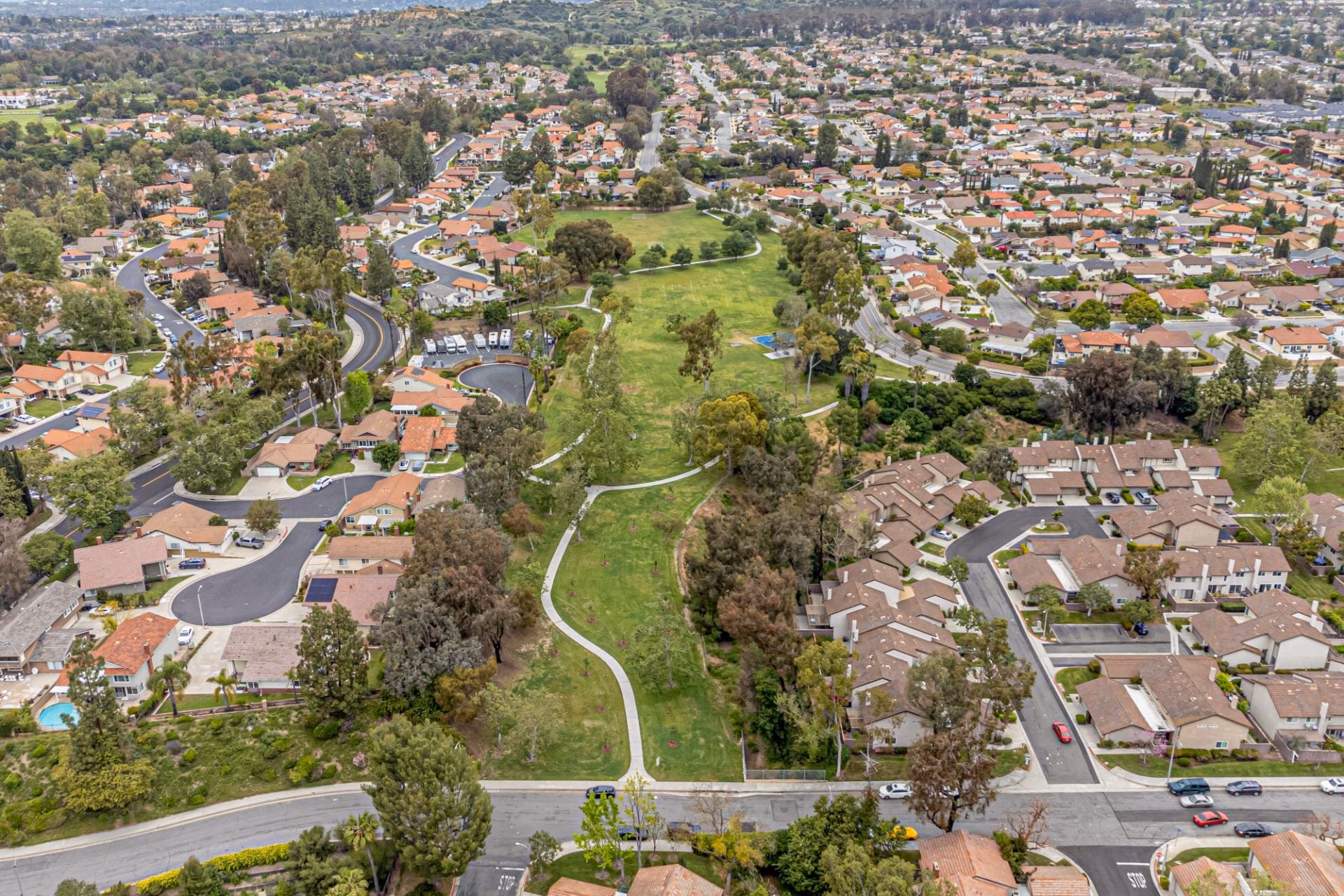 Aerial view of a neighborhood park surrounded by homes